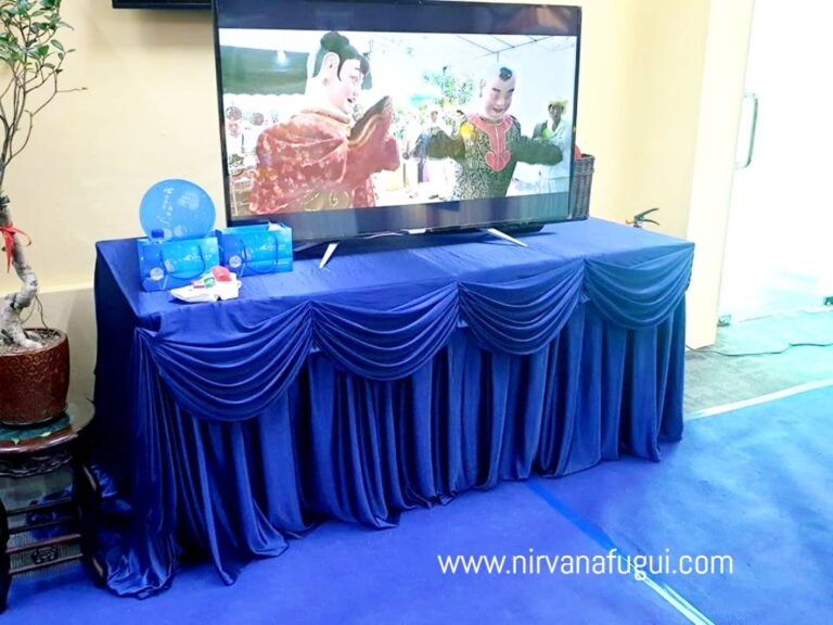 TV is setup to display memorial photos or videos of deceased during funeral service