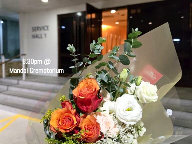 Presented fresh flowers to show respect at Mandai Crematorium