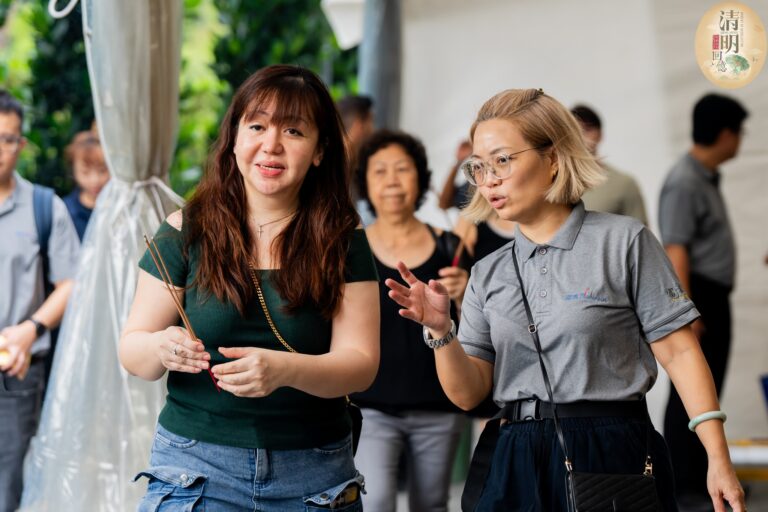 Nirvana staff assisting families with Qing Ming prayers